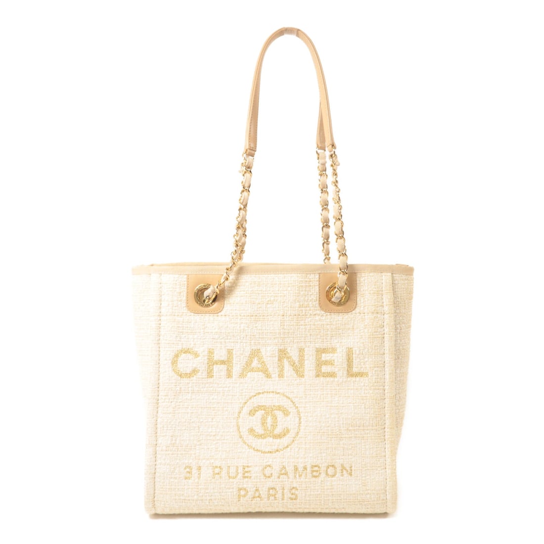 Chanel Deauville Tote Beige: Deauville tote bag in beige canvas with gold hardware; includes storage bags, hologram sticker, and guarantee; 25.5 x 25.5 x 11 cm.