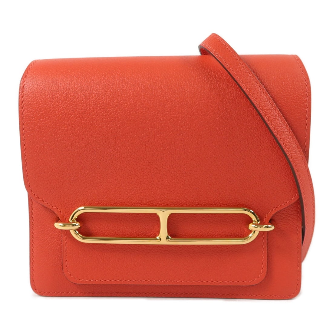 Hermes Roulis Mini Rouge: Roulis Mini shoulder bag in Rouge Tomate Evercolor leather with gold hardware; includes box and storage bags; 17.5 x 15.5 x 5.5 cm.