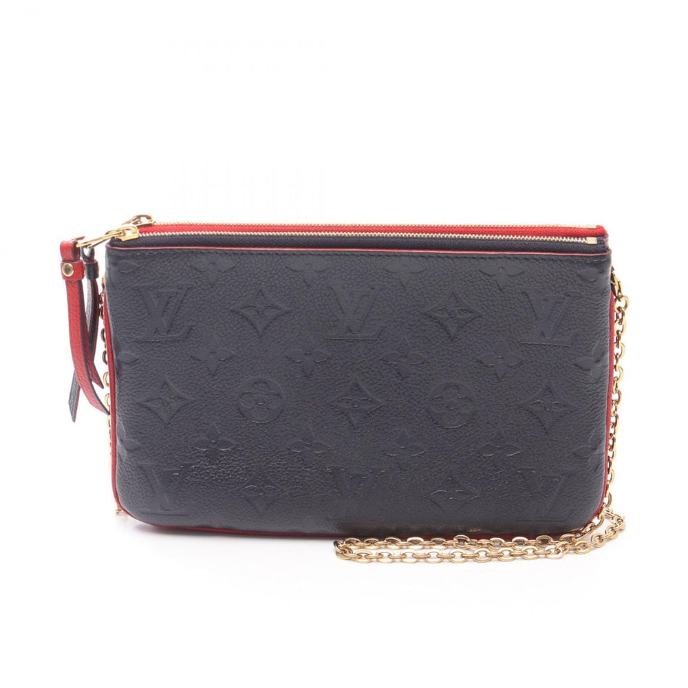 LV Double Zip Empreinte Marine: Authentic and authenticated Louis Vuitton Pochette Double Zip Monogram Empreinte Marine Rouge chain shoulder bag in navy red leather. Model M63916, product GI1189. Approx. 13 x 20/21 cm.