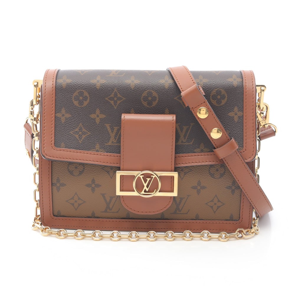 Louis Vuitton Dauphine MM Chain Bag: Brown beige light brown monogram reverse PVC and leather chain shoulder bag; includes shoulder strap; H19.5 x W24/24.5 cm. Authentic and authenticated.