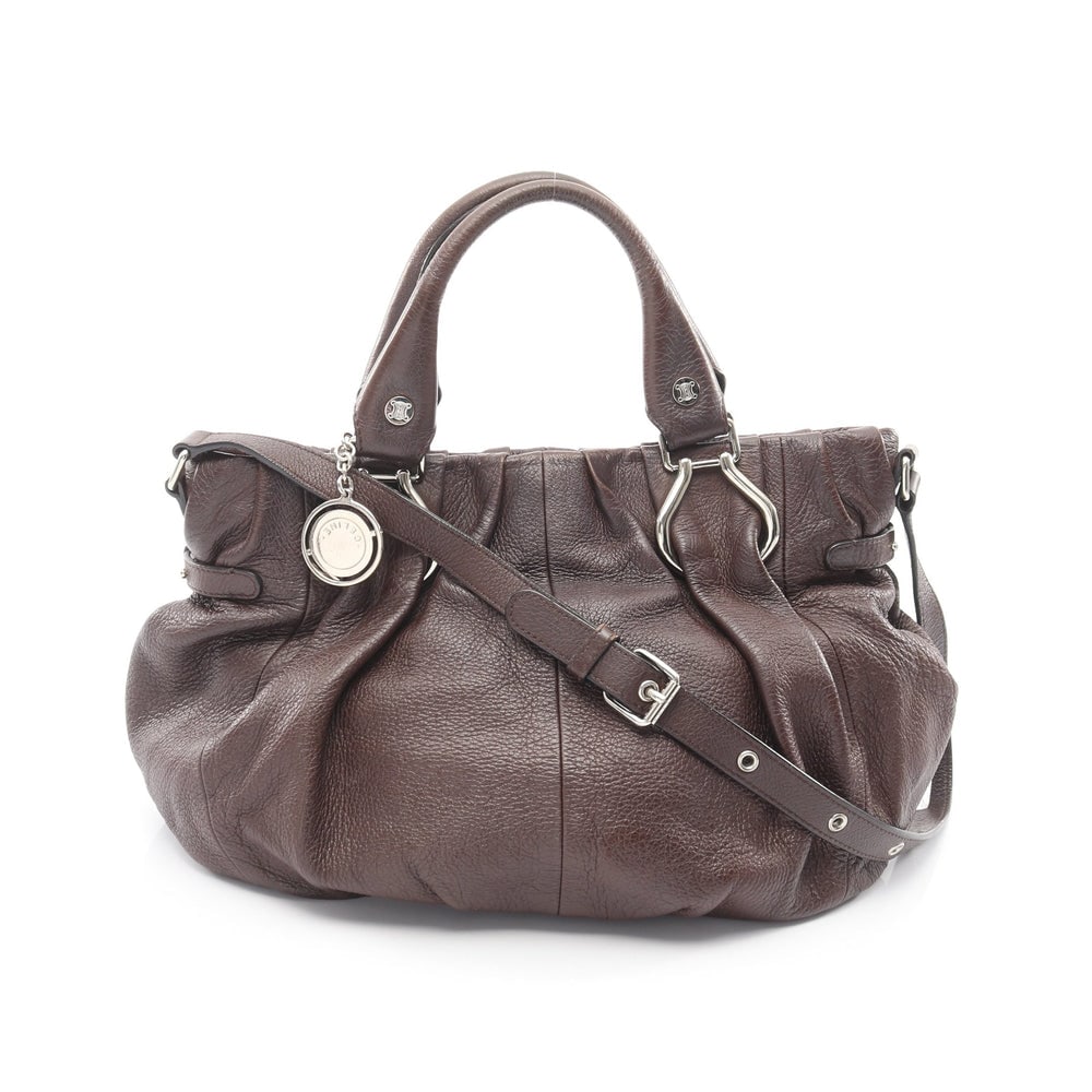 Celine Pillow Small 2Way Brown: Celine Pillow Small 2Way Shoulder Bag. Color: Dark Brown. Material: Leather. Size: 33/24.5 X 25 X 17 Cm. Handle: 34 Cm. Strap: 54-76 Cm.
