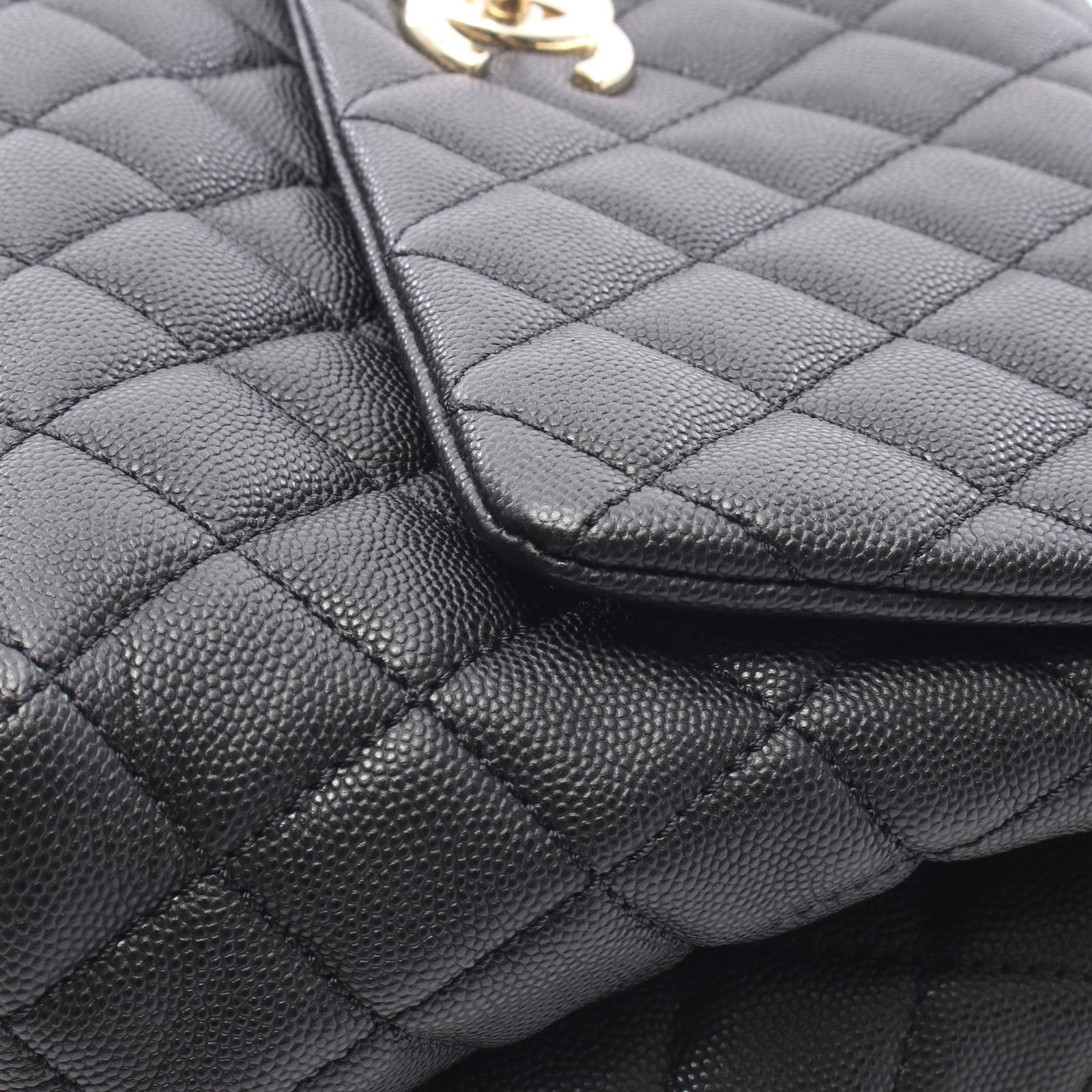 Chanel Coco Handle 29 Black: Black caviar skin Coco Handle 29 top handle flap bag with gold-tone hardware.