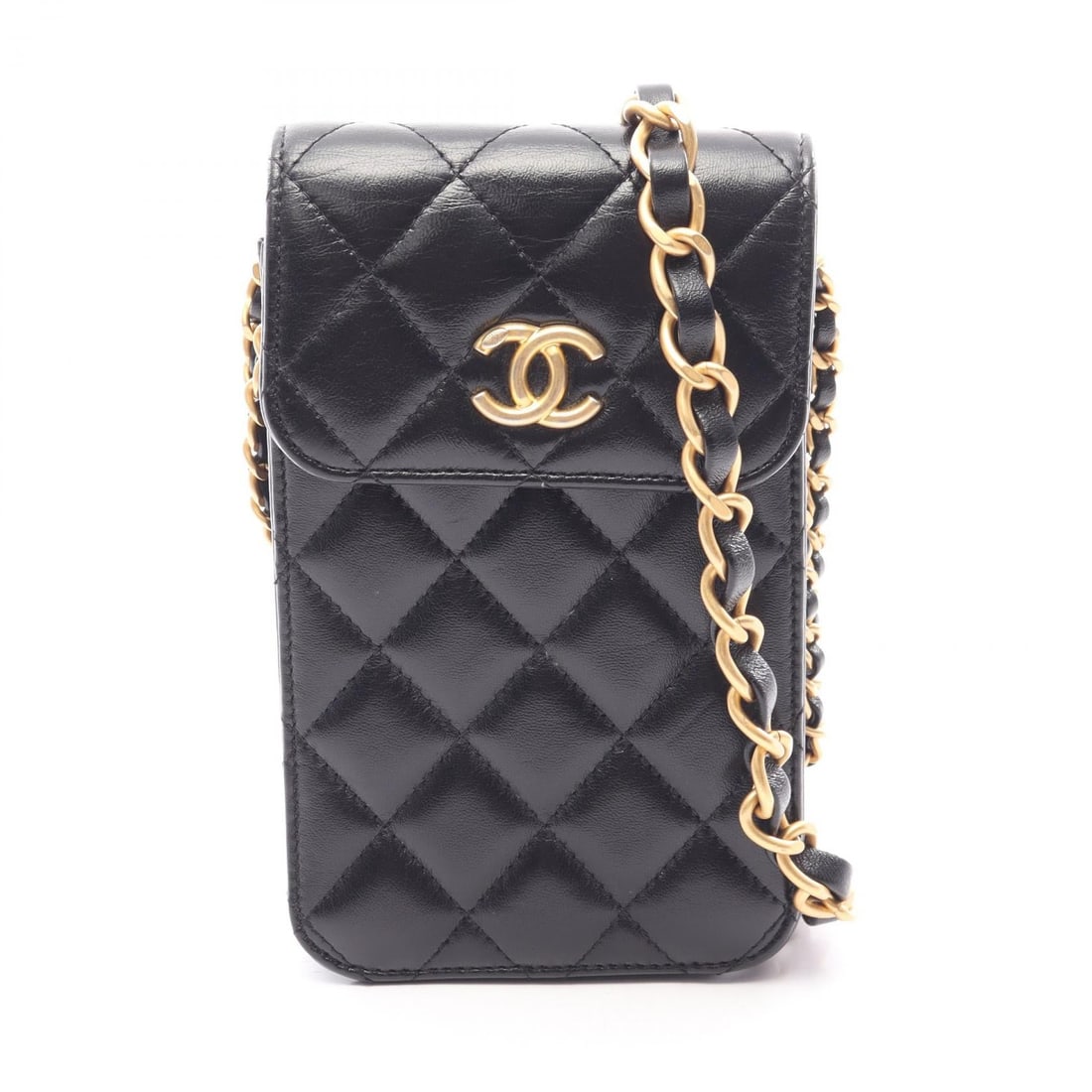 Chanel Phone Holder Chain Bag: Authentic and authenticated Chanel Matelasse phone holder chain shoulder bag in black lambskin with gold hardware. Approx. 17H x 10W x 3D cm with 113 cm strap. Includes serial seal.