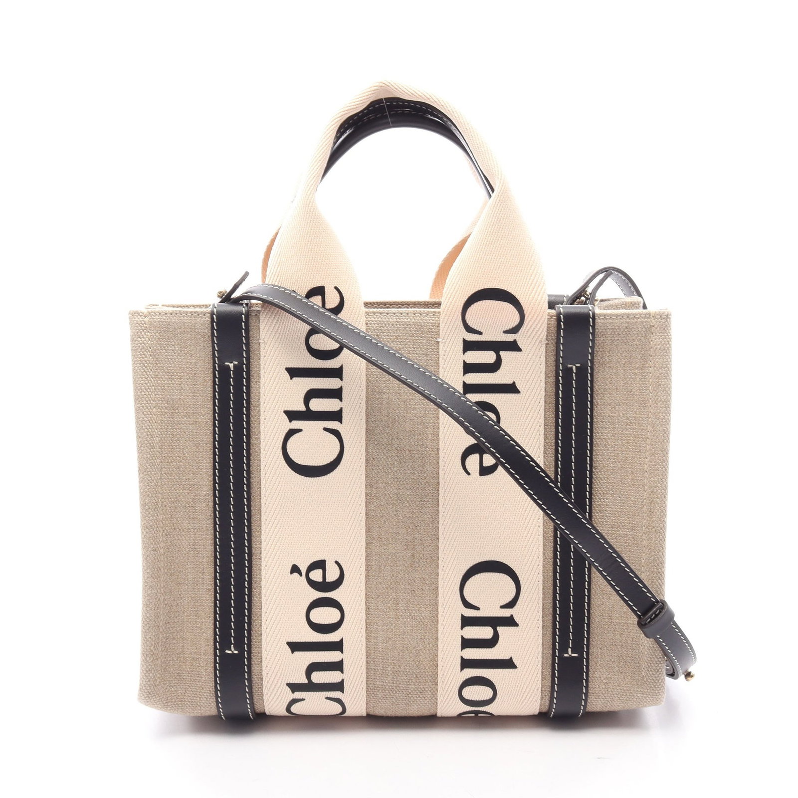 Chloe Woody Small 2WAY Tote Beige: Authentic and authenticated Chloe Woody Small 2WAY tote in beige/black canvas and leather. Model CHC22AS397. Approx. 20H x 25/26W x 8D cm with 29 cm handle and 112-120 cm strap. Includes shoulder