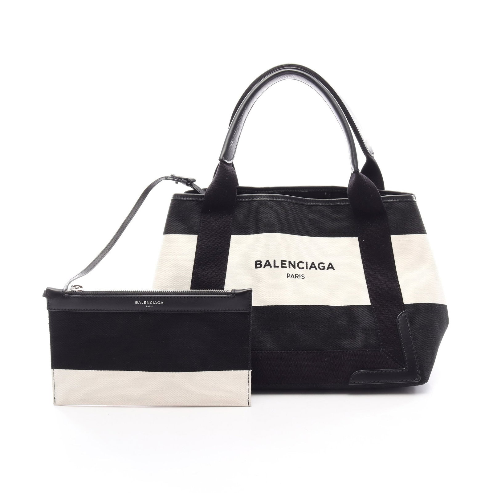 Balenciaga Navy Cabas S 2WAY Tote: Authentic and authenticated Balenciaga Navy Cabas S 2WAY tote in white/black canvas and leather. Model 339933. Approx. 22H x 32/30W x 18D cm with 45 cm handle. Includes pouch.
