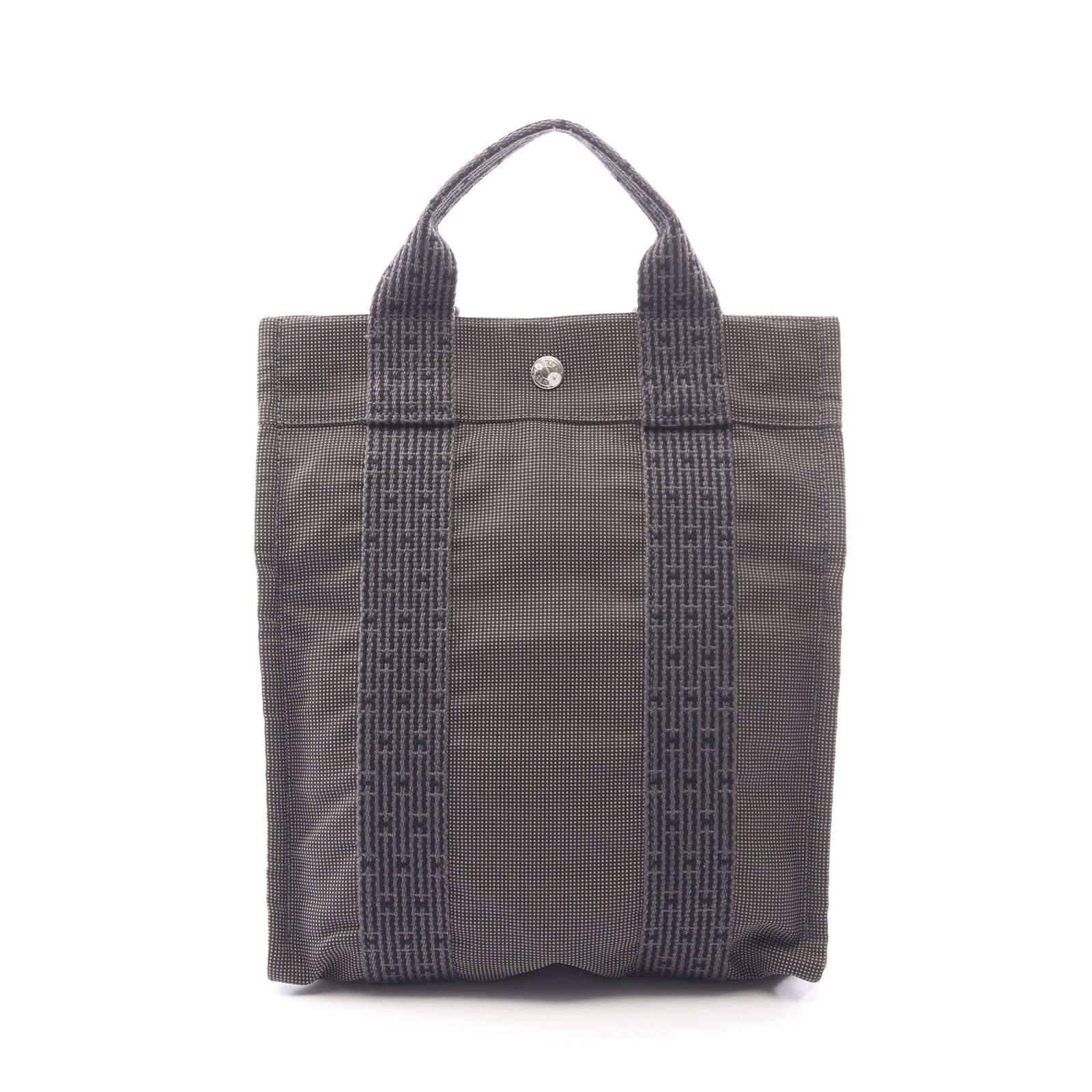 Hermes Yell Line Ad PM Nylon Backpack: Authentic and authenticated Hermes Yell Line Ad PM backpack in dark gray nylon canvas with silver hardware. Approx. 30H x 26/25.5W x 6D cm with 42-75 cm straps and 25 cm handle. No accessories listed.