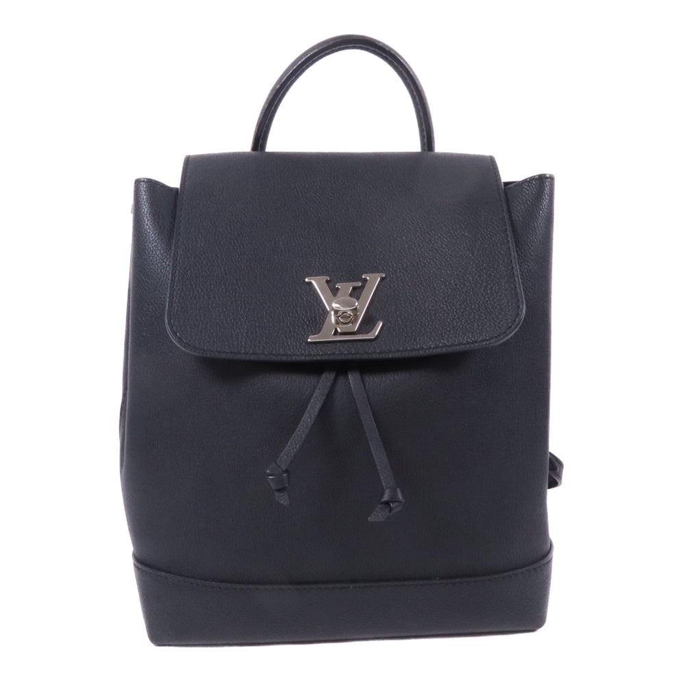 Louis Vuitton Lock Me Backpack: Black calfskin Lock Me backpack with SHW; W21 x H27 x D12 cm; handle 25 cm; strap 68-78 cm. Authentic and authenticated.
