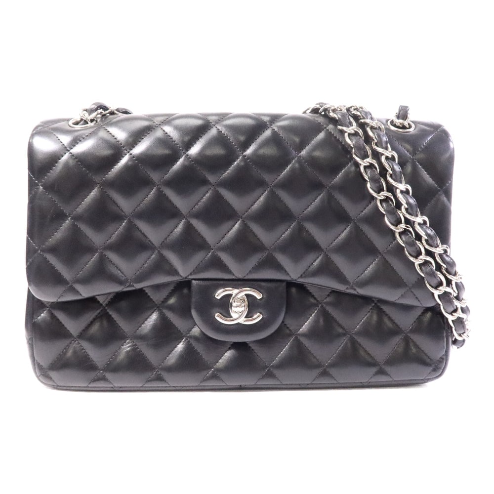 Chanel Large Classic Black: Black lambskin large classic chain shoulder bag with silver hardware. Includes box hologram and guarantee. 30 x 21 x 9 cm.