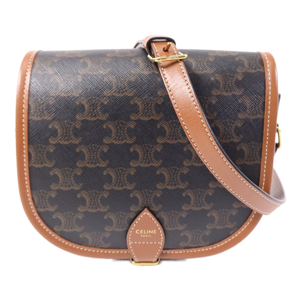 Celine Folco Brown Coated Canvas: Folco shoulder bag in brown coated canvas with gold hardware. Includes storage bags. Size 18.5 x 16.5 x 7 cm.
