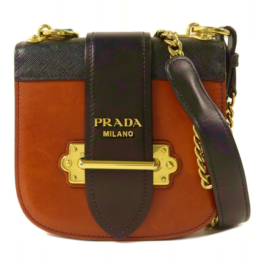 Prada Chain Shoulder Brown Black: Chain shoulder bag in brown and black calfskin. Includes storage bags and guarantee. Size 16 x 15 x 4 cm.