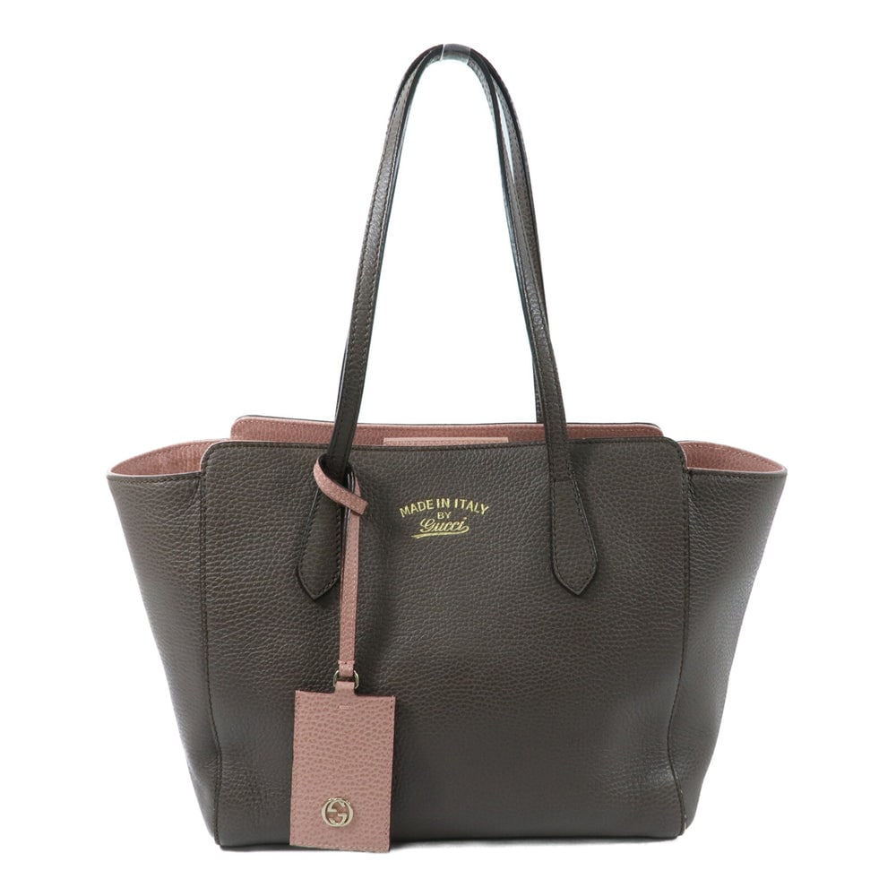 Gucci Brown Calfskin Tote Bag: Authentic and authenticated Gucci tote bag in brown calfskin. Product no. 525040. Approx. 27W x 24H x 14D cm with 52 cm handle. Includes name tag.