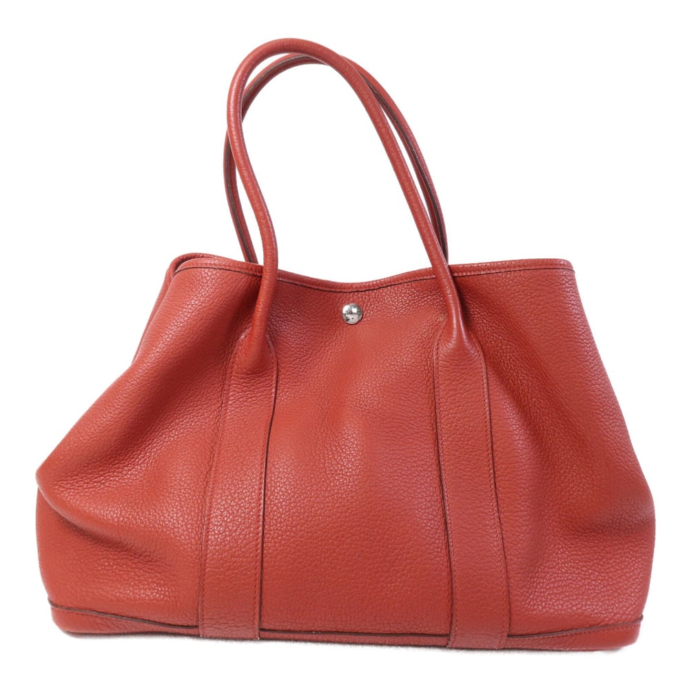 Hermes Garden Party PM Tote: Potiron orange Negonda calfskin tote with PHW; W36 x H26 x D17 cm; handle 37 cm. Authentic and authenticated.