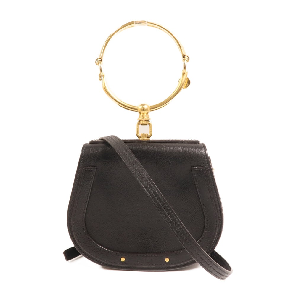 Chloe Nile 2 Way Shoulder Bag Black: Authentic and authenticated Chloe Nile 2 Way shoulder bag in black calfskin. Product no. 01186865. Approx. 19W x 16H x 6D cm with 14 cm handle drop and 47-64 cm shoulder strap. Includes shoulder strap