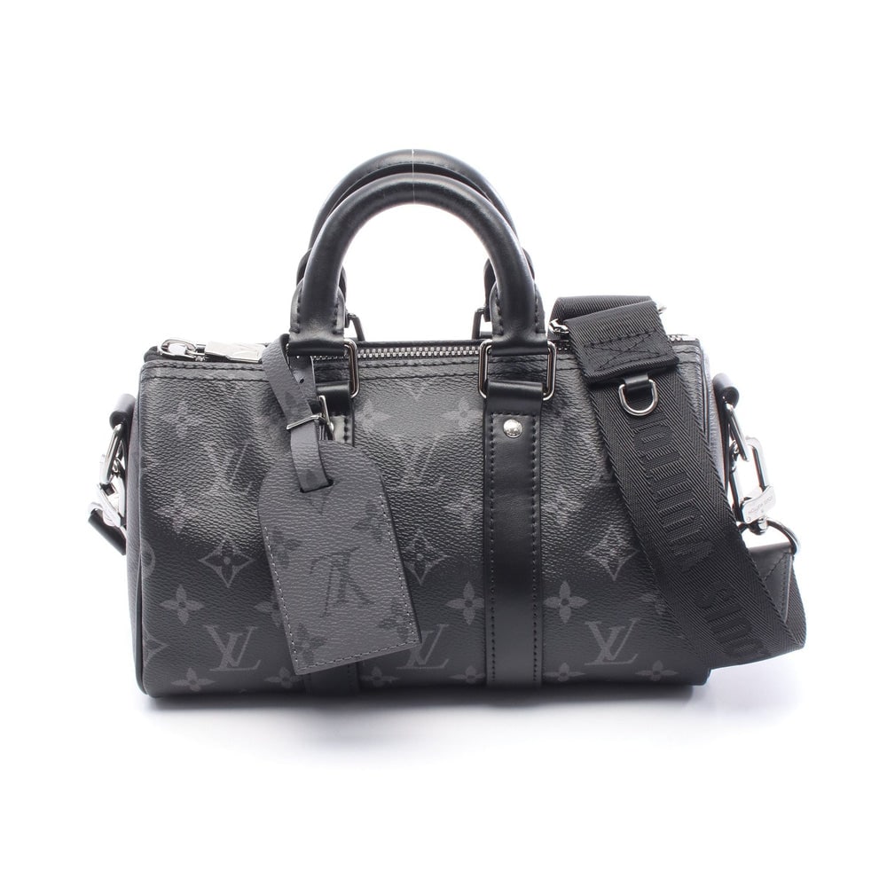 LV Keepall 25 Eclipse Reverse: Black and gray monogram eclipse PVC and leather 2 way handbag; includes charm and shoulder strap; H15 x W25 x D10 cm. Authentic and authenticated.