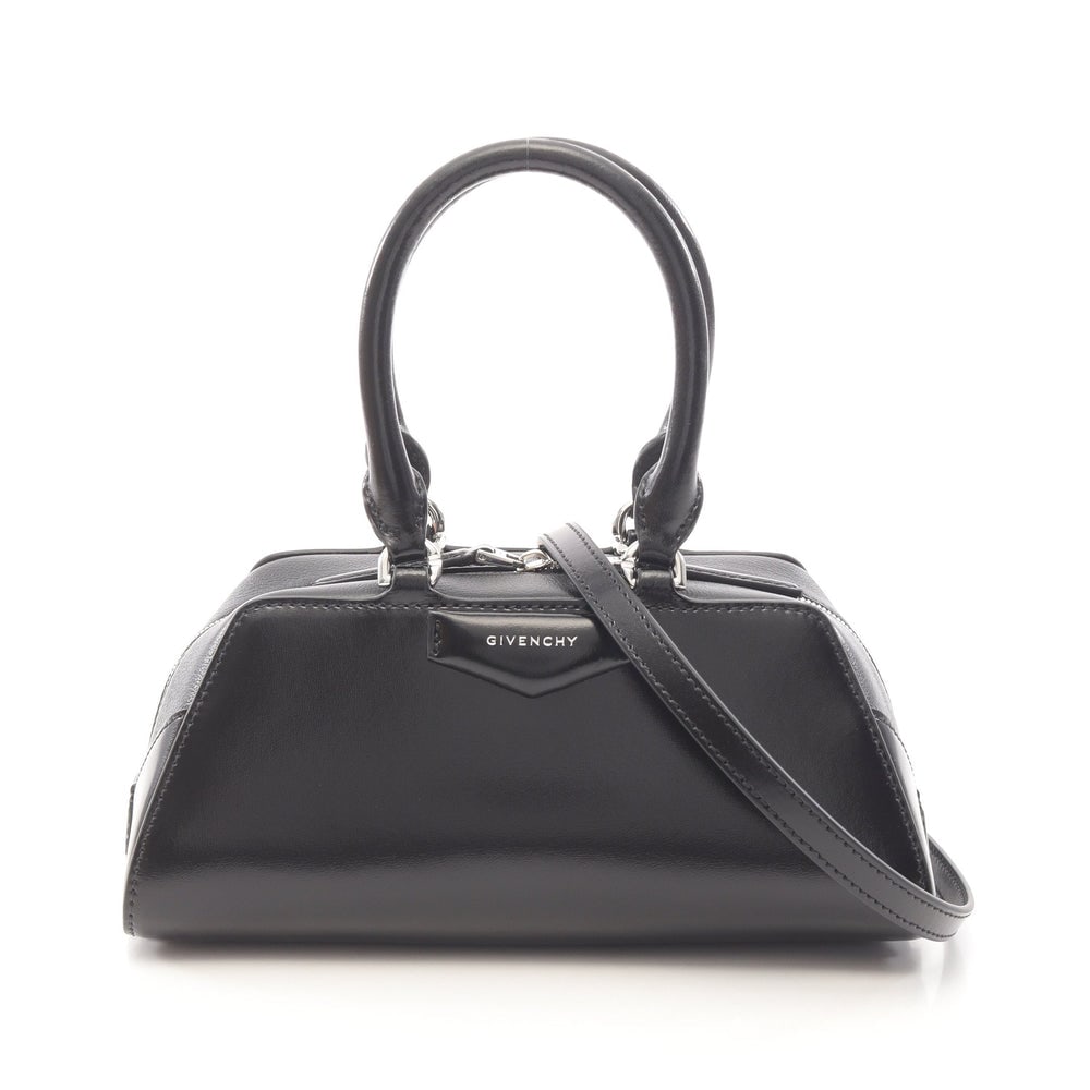 Givenchy Antigona Mini 2Way Black: Black leather Antigona East-West mini handbag. Includes storage bag and strap. 23 x 10 x 11 cm.