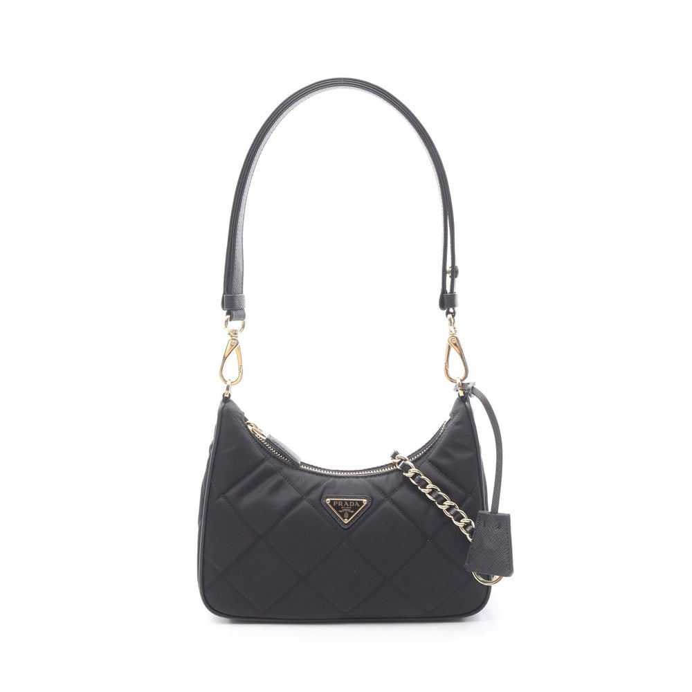 Prada Re-Nylon 2Way Black: Black nylon and saffiano leather 2Way shoulder bag. Includes chain strap and key ring crochet. 22 x 12 x 6 cm.