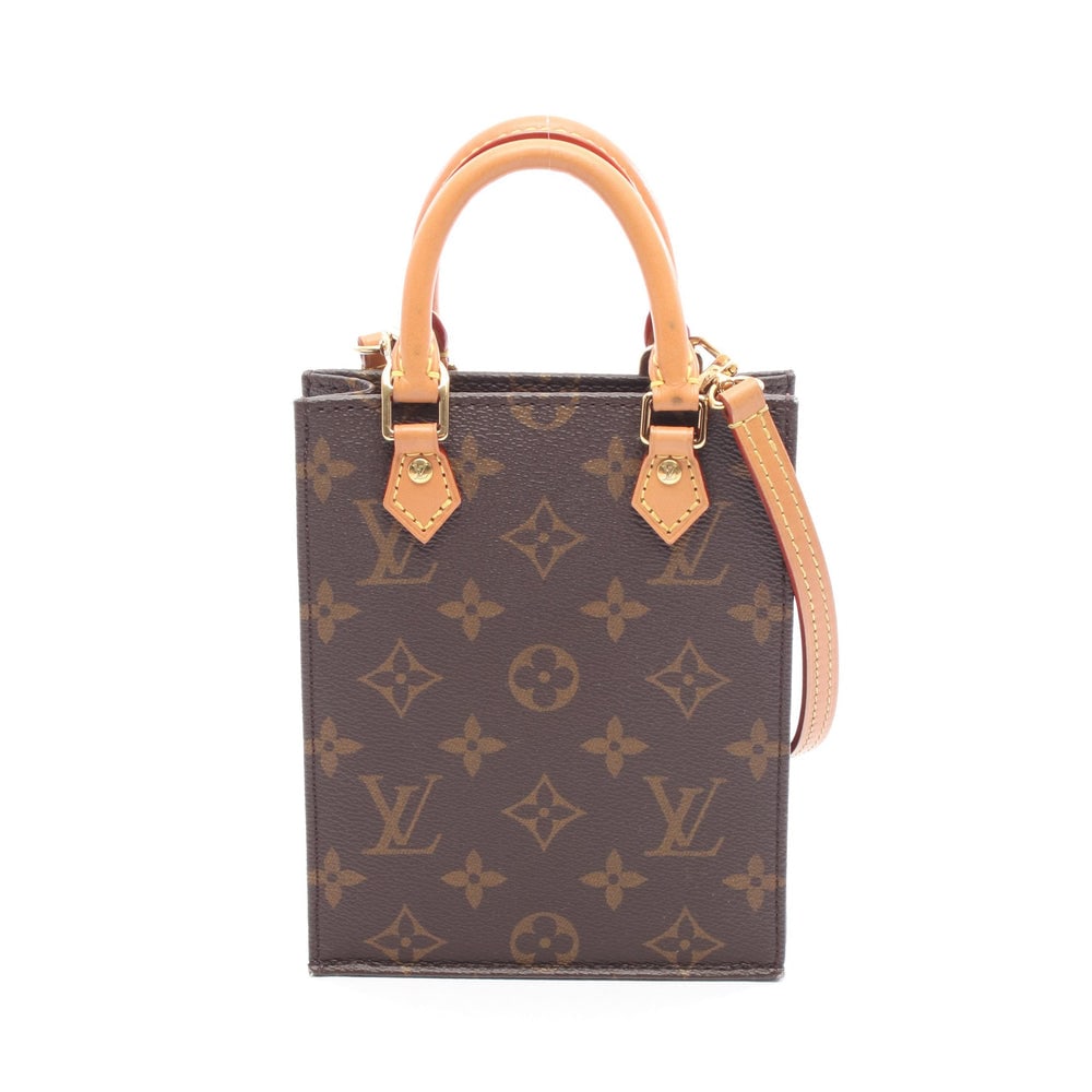 LV Petite Sac Plat Brown: Brown Monogram PVC leather Petite Sac Plat 2-way handbag with shoulder strap. Approx. 13.5 x 17 x 4.5 cm; handle 20 cm; strap 116 cm. Model M69442, RFID. Authentic and authenticated.