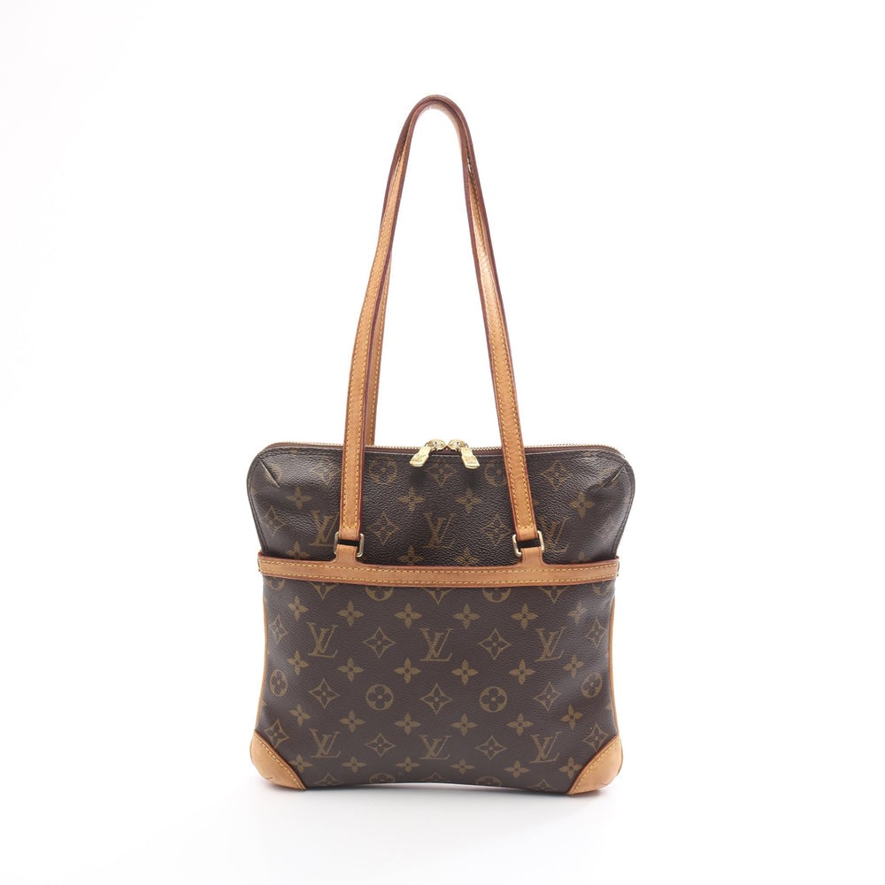 Louis Vuitton Kusan GM Monogram: Authentic and authenticated Louis Vuitton Kusan GM Monogram shoulder bag in brown PVC and leather. Model M51141, product no. VI0084. Approx. 26H x 26/28W x 3.5D cm with 64 cm strap.