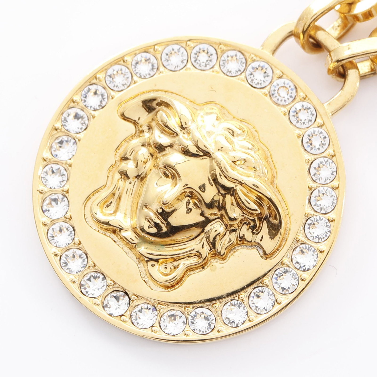 Versace Medusa Greca Necklace: Medusa Greca necklace in gold plated finish with clear rhinestones.