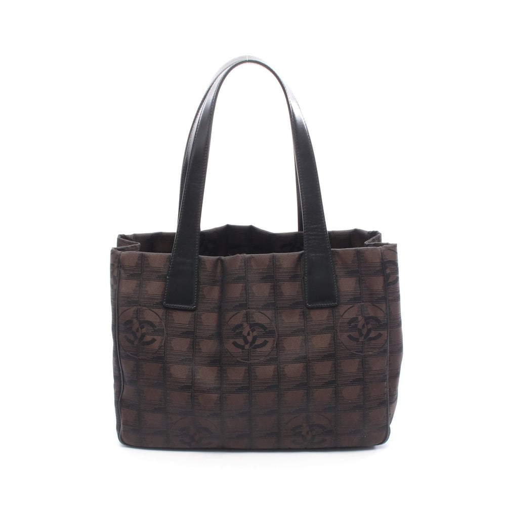 Chanel New Travel Line Pm Brown: Chanel New Travel Line Pm Handbag Tote Bag. Color: Dark Brown Black. Material: Canvas Leather. Size: 29 X 21 X 12 Cm. Handle: 49 Cm. Includes: Serial Seal.