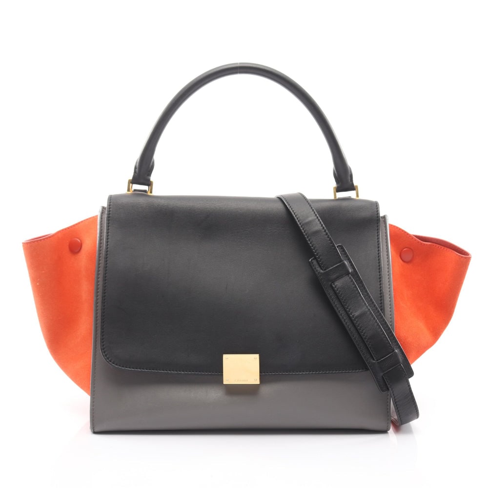 Celine Trapeze Medium 2WAY Bag: Authentic and authenticated Celine Trapeze Medium 2WAY handbag in black, orange brown, and gray leather suede. Model 169543. Approx. 25H x 51/30W x 17D cm with 40 cm handle and 77 cm strap.