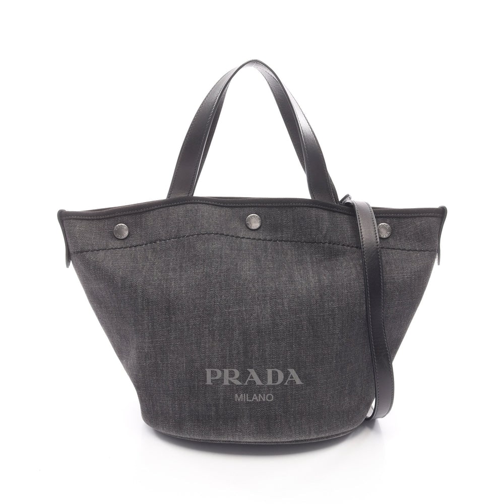 Prada Denim City Calf 2Way Tote Black: Authenticated genuine Prada DENIM+CITY CALF 2WAY handbag tote in black denim and leather, model 1BG244. Includes shoulder strap. Approx. H26 x W42 top/24 base x D19 cm, strap 90-102 cm, handle 35 cm.