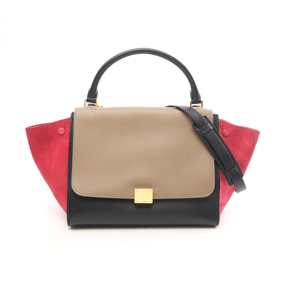 Celine Trapeze Medium 2Way: Celine Trapeze Medium Handbag 2Way. Color: Black Beige Pink Purple. Material: Leather Suede. Size: 48/30 X 25 X 18 Cm. Handle: 39 Cm. Strap: 78 Cm. Includes: Shoulder Strap.