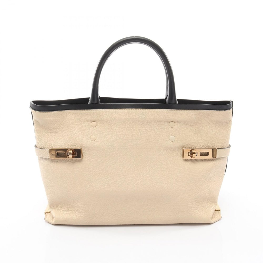 Chloe Charlotte Leather Tote Ivory: Authentic and authenticated Chloe Charlotte tote handbag in ivory and black leather. Approx. 24H x 40/36W x 18D cm with 37 cm handle. Includes inner pouch.