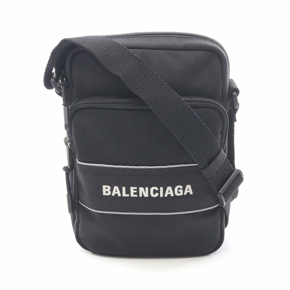 Balenciaga Sports Nylon Shoulder Bag Black: Authenticated genuine Balenciaga Sports shoulder bag in black nylon, model 638657. Approx. H22 x W15 x D0.25 cm with an 80-149 cm strap. No accessories listed.