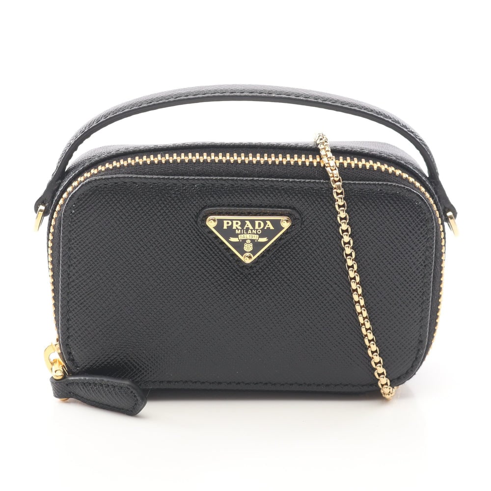 Prada Triangle Mini Pouch Black: Black saffiano leather mini pouch with chain shoulder strap. Includes box. 11 x 6.5 x 3.5 cm.