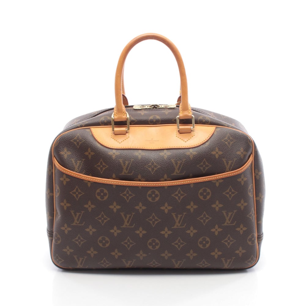 Louis Vuitton Deauville Monogram: Authentic and authenticated Louis Vuitton Deauville Bowling vanity Monogram handbag in brown PVC and leather. Model M47270, product no. VI1927. Approx. 25H x 32/35W x 14D cm with 36 cm handle.