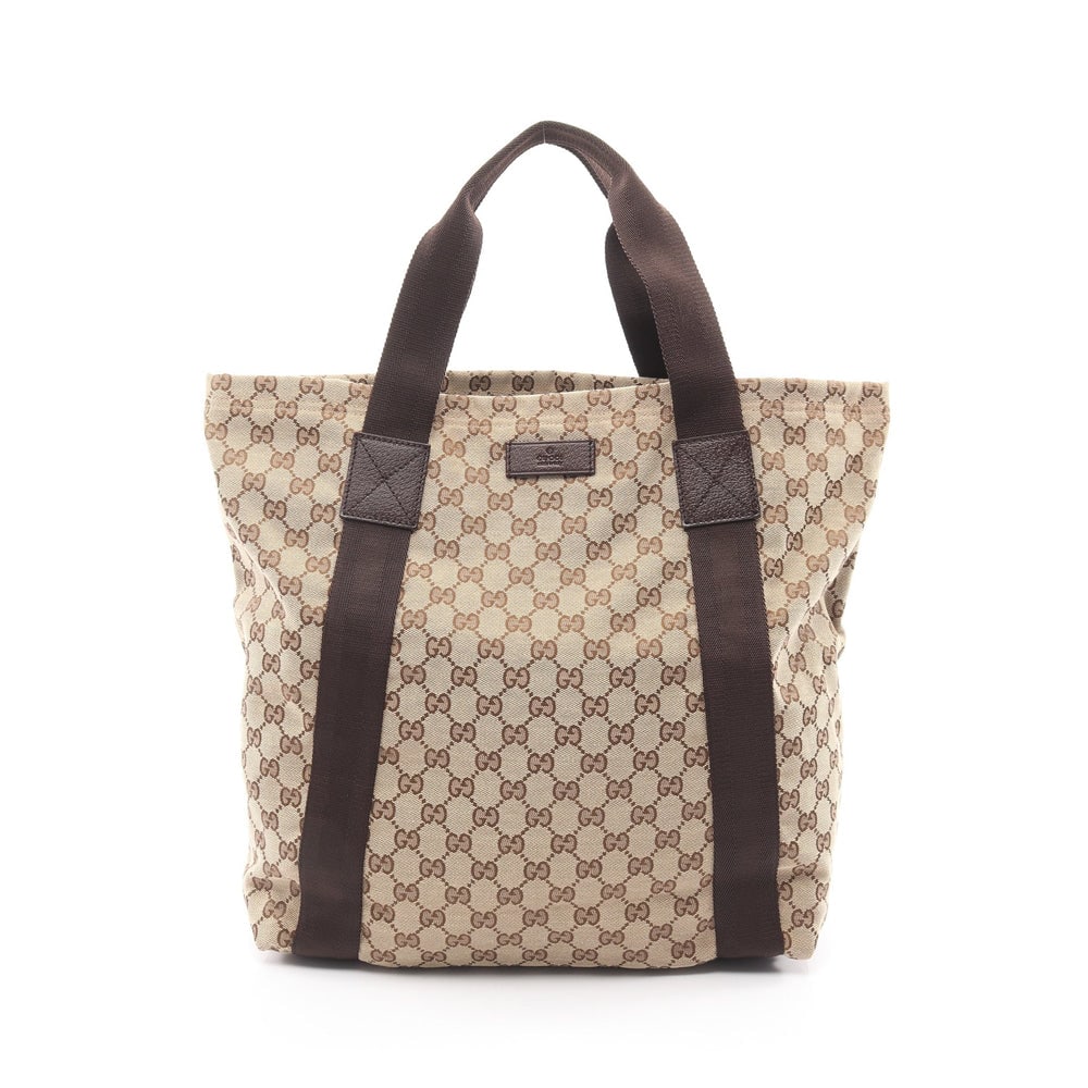 Gucci GG Canvas Tote Beige Brown: Authentic and authenticated Gucci GG canvas tote handbag in beige and brown canvas leather. Model 189669. Approx. 37H x 43/33W x 12.5D cm with 46 cm handle.