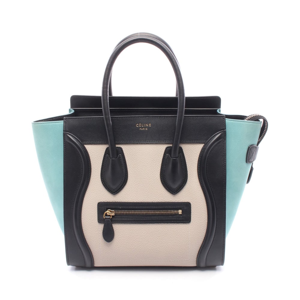Celine Luggage Micro Shopper Bag: Authentic and authenticated Celine Luggage Micro Shopper handbag tote in black, ivory, light blue leather nubuck. Model 167793. Approx. 26 x 40/26 x 13 cm with 45 cm handle.
