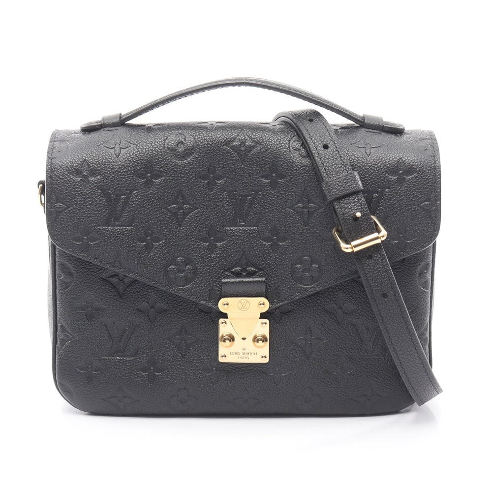 Louis Vuitton Pochette Metis MM: Black monogram empreinte leather handbag; H19 x W24.5/25 x D1.5/4.5 cm; handle 16 cm; strap 112-127 cm. Authentic and authenticated.