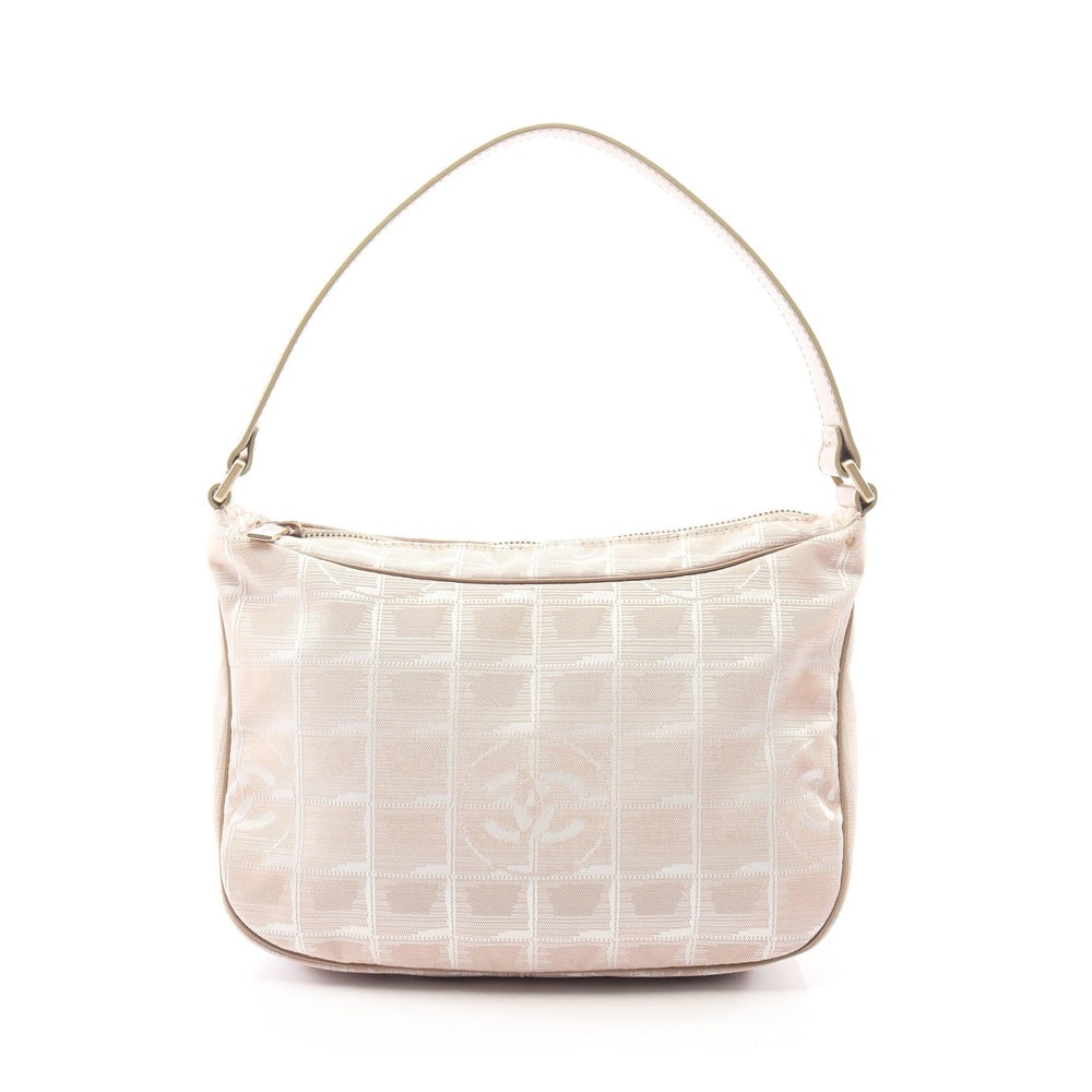 Chanel New Travel One Shoulder Beige: New Travel Line one shoulder bag in beige nylon canvas and leather with gold-tone hardware. Size 24 x 15 x 7.5 cm.