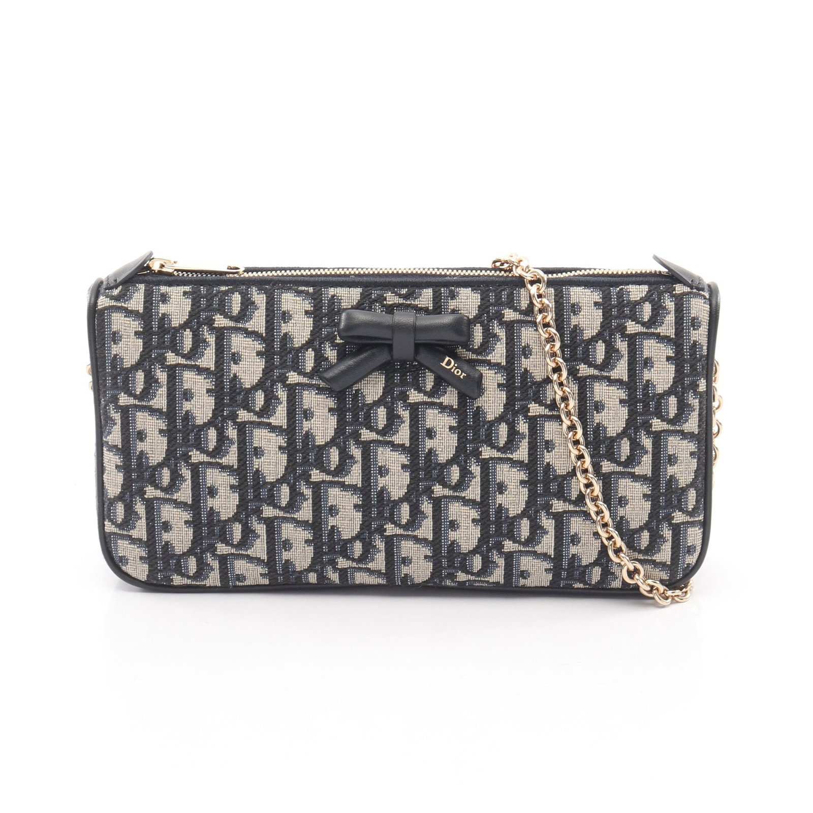 Dior Oblique Bow Chain Bag: Authentic and authenticated Christian Dior Oblique Bow chain shoulder bag in beige and navy canvas leather. Model S2504OUQYM928. Approx. 12H x 22W x 4D cm with 62 cm strap. Includes storage bags.