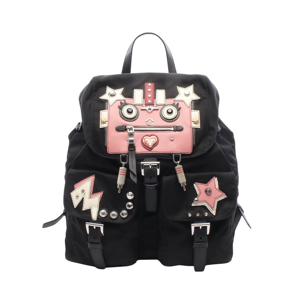 Prada Tessuto Robot Backpack: Tessuto Robot backpack in black, pink, and white nylon and leather. Includes guarantee card. Size 30 x 31 x 15 cm.