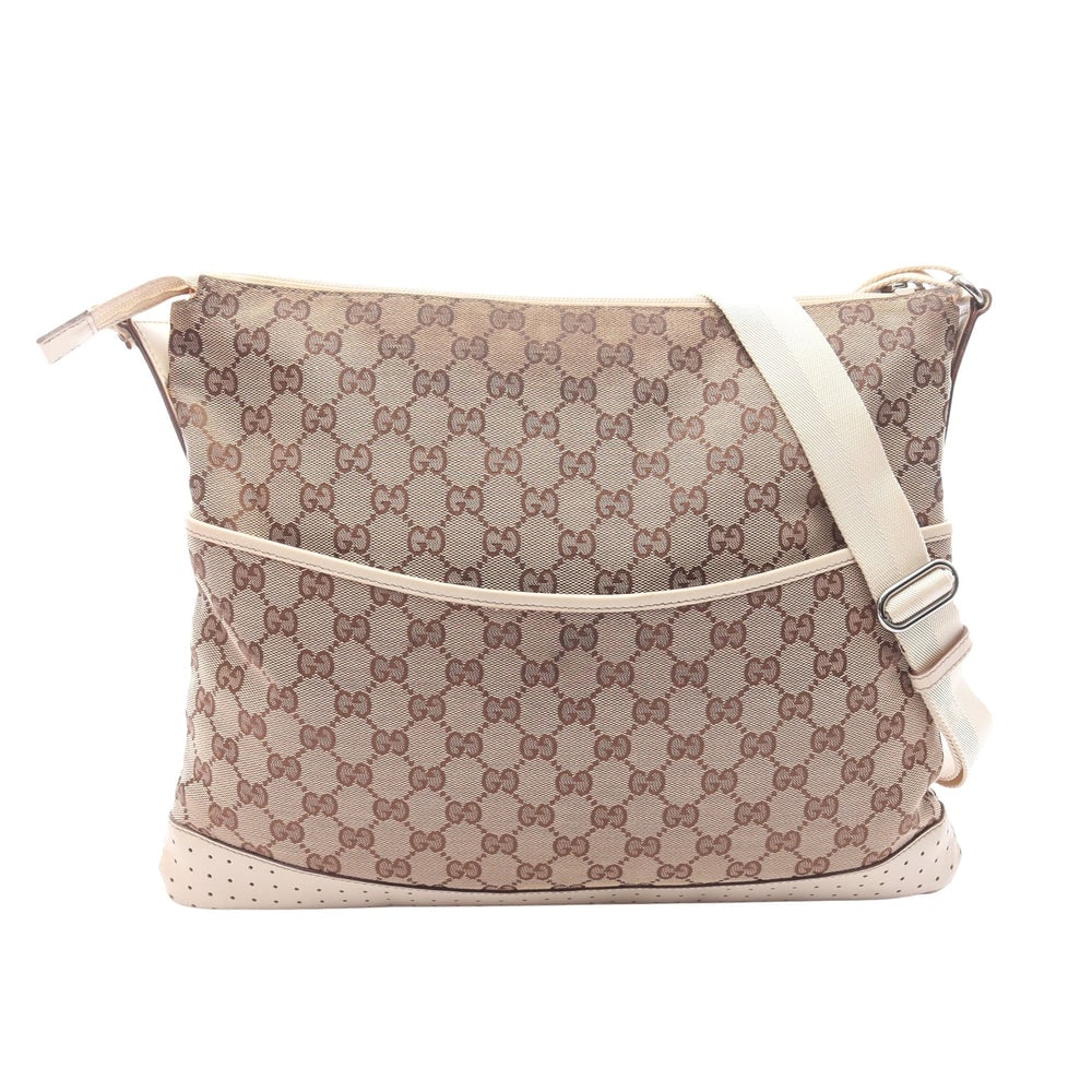 Gucci GG Canvas Shoulder Beige Ivory: GG canvas shoulder bag in beige and ivory with leather trim. Size 37.5 x 31 x 2 cm. Strap 80 to 150 cm.