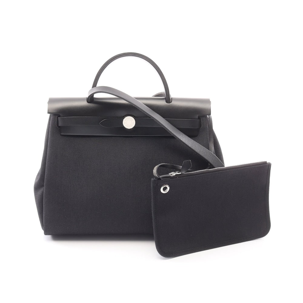 Hermes Herbag Zip PM: Black toile military and leather 2 way bag.
