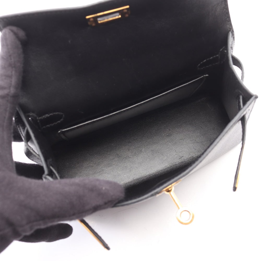 Hermes Mini Kelly 2 Black: Black Veau Epsom outside sewing 2-way mini handbag with gold-tone hardware.