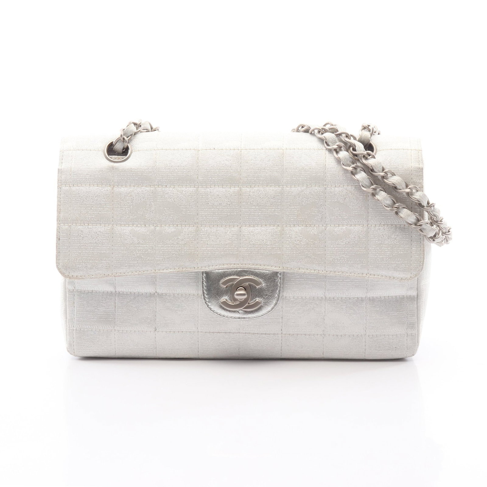 Chanel New Travel W Chain Silver: Authentic and authenticated Chanel New Travel Line W chain shoulder bag in silver nylon canvas leather with silver hardware. Model A15285. Approx. 16H x 25W x 6D cm with double or single chain wear. I