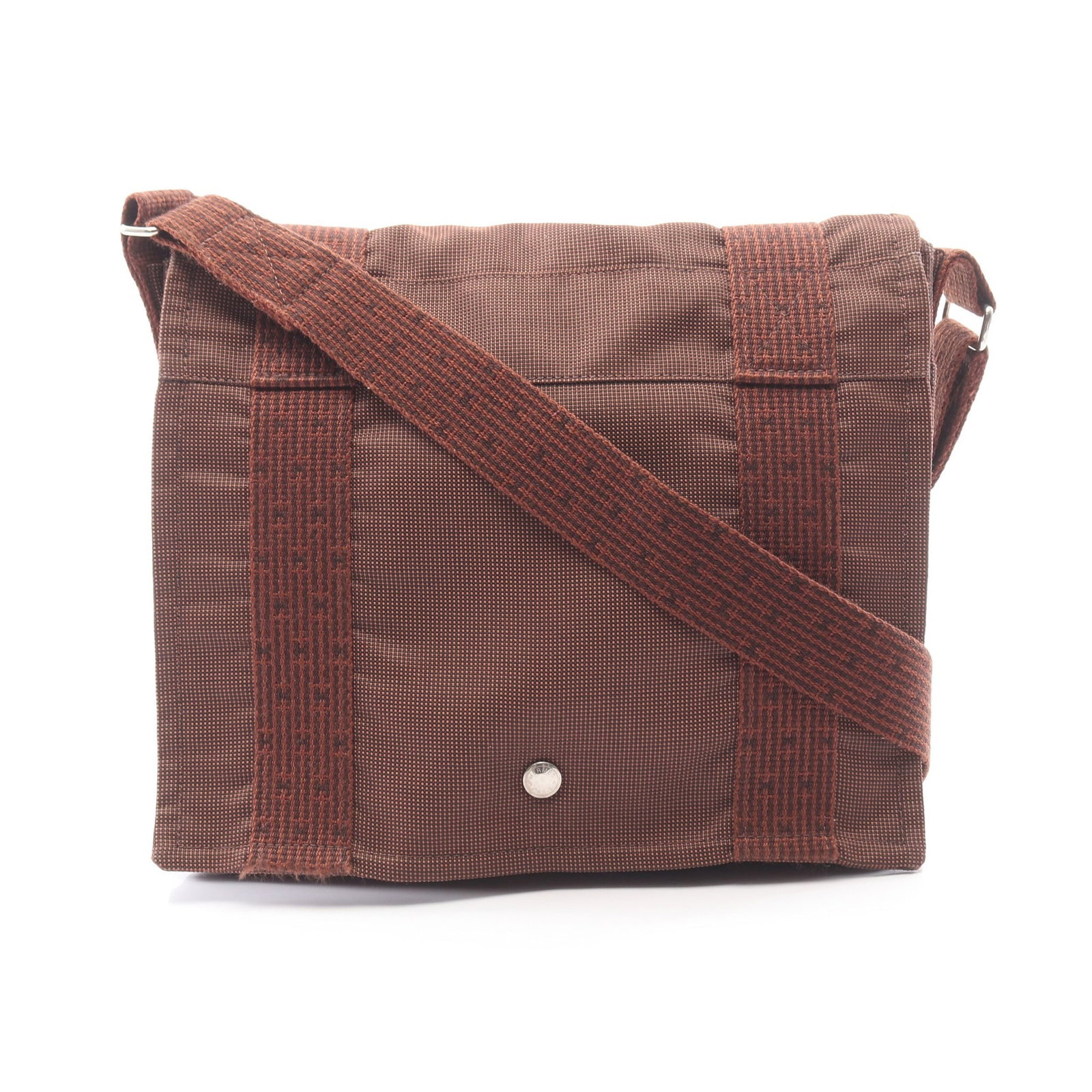 Hermes Yell Line Bass PM Nylon Shoulder Bag: Authentic and authenticated Hermes Yell Line Bass PM shoulder bag in brown nylon canvas with silver hardware. Approx. 27H x 30W x 7D cm with 73-119 cm strap. No accessories listed.