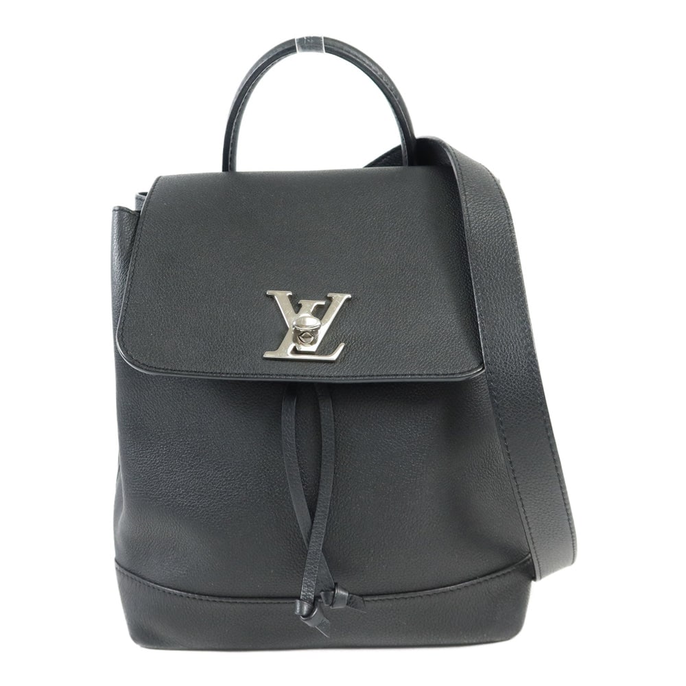 Louis Vuitton Lock Me Backpack: Black calfskin Lock Me backpack with SHW; W21 x H27 x D12 cm; handle 25 cm. Authentic and authenticated.