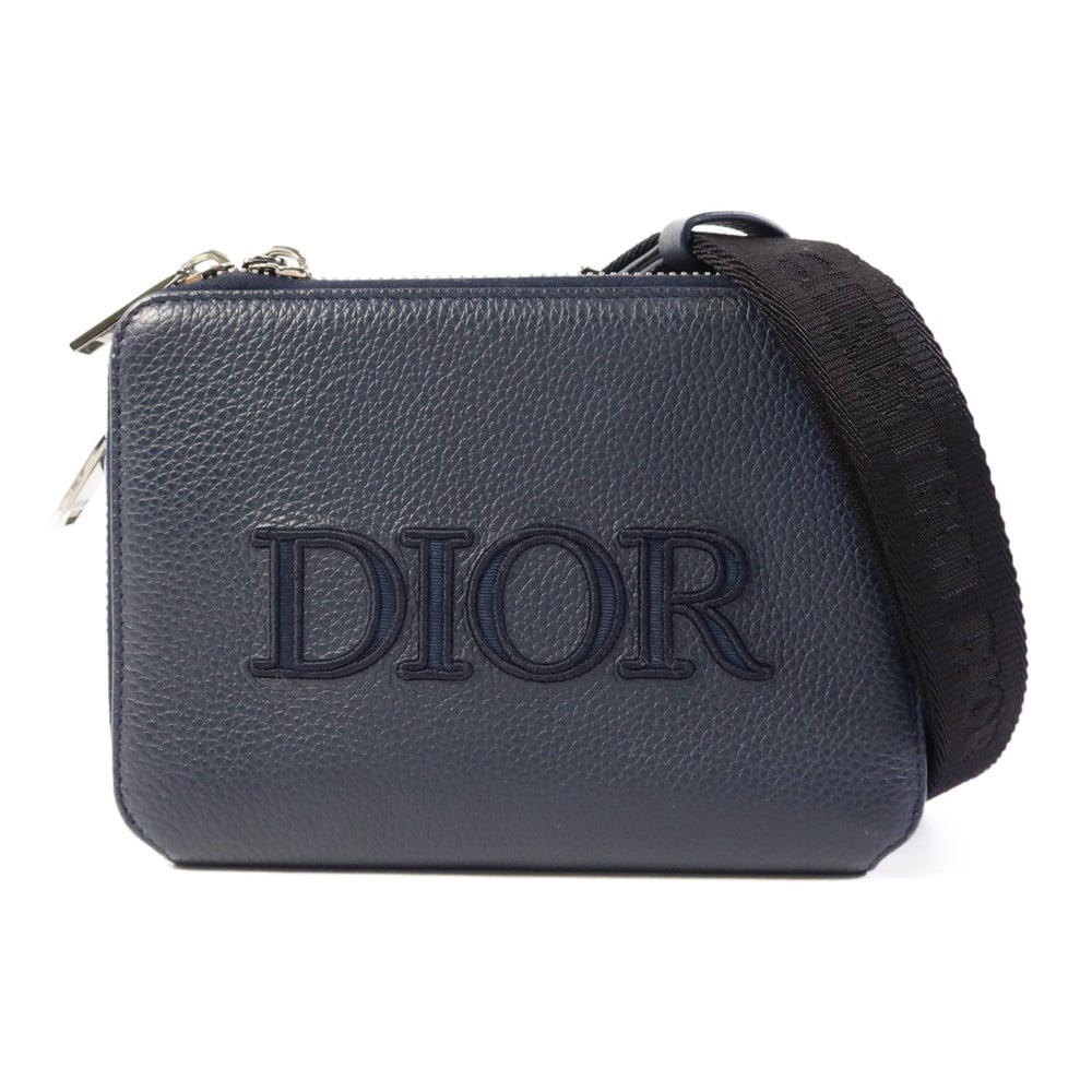 Dior Shoulder Bag Navy: Navy calfskin Dior shoulder bag with storage bags and shoulder strap. Approx. 17 x 12 x 5.5 cm; strap 72.5-133 cm. Product no. 10-BO-1210. Authentic and authenticated.