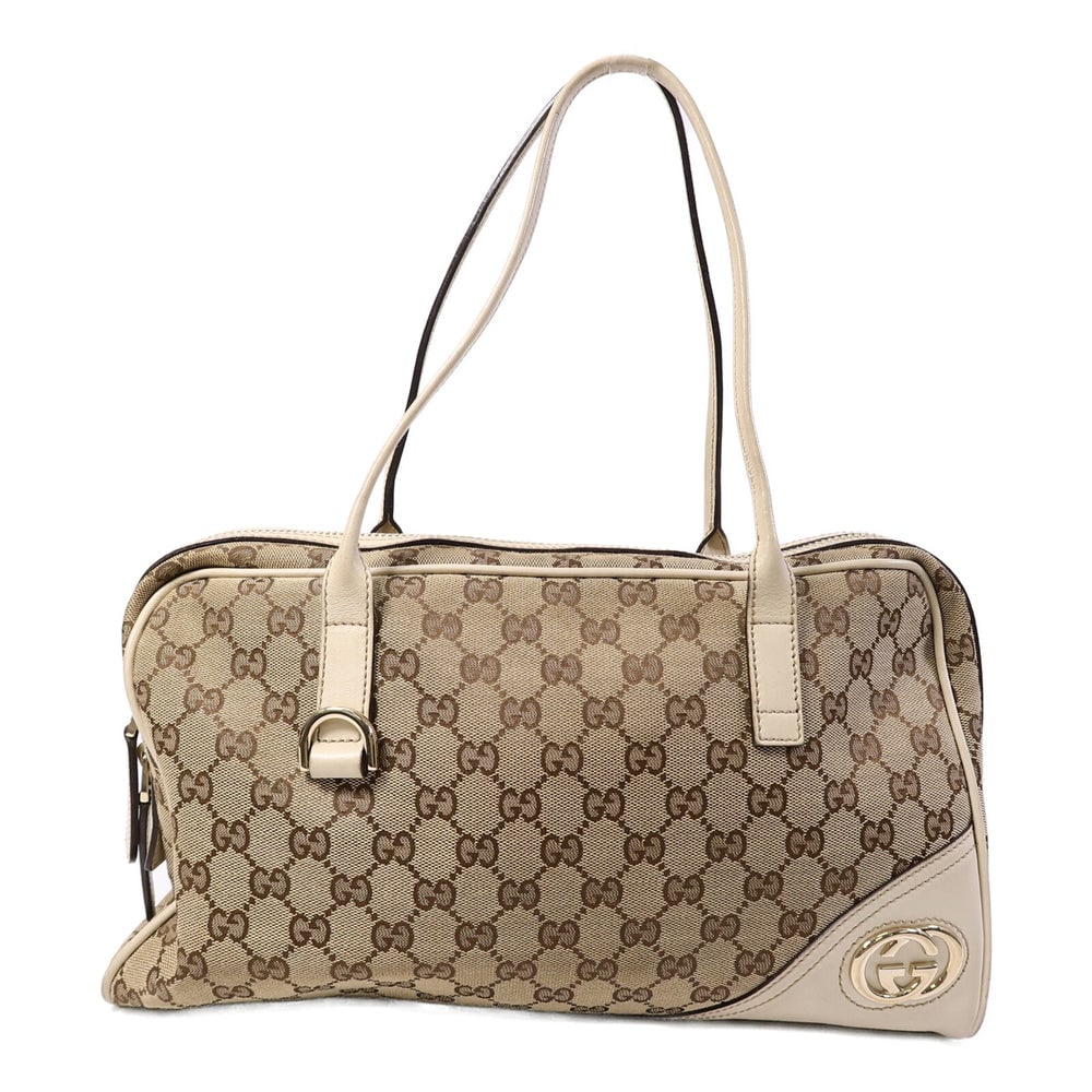 Gucci GG Canvas Shoulder Bag Brown: GG shoulder bag in brown GG canvas with gold-tone hardware. Size 35 x 20 x 9 cm. Shoulder 47 cm.