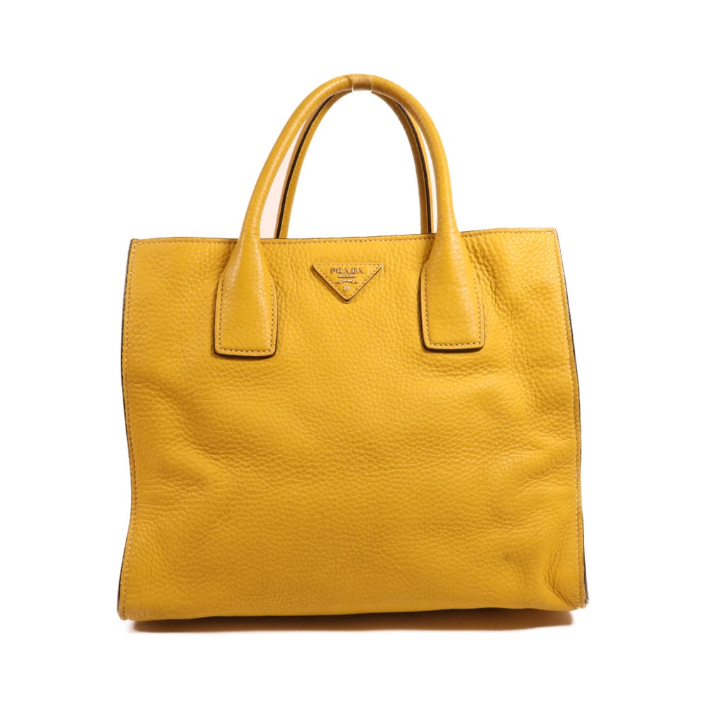 Prada Yellow Calfskin 2 Way Bag: Authentic and authenticated Prada 2 way shoulder handbag in yellow calfskin. Product no. 173. Approx. 30W x 25H x 18D cm with 35 cm handle. No accessories listed.