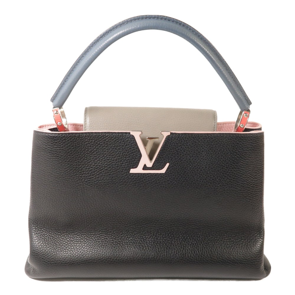 Louis Vuitton Capucines MM Hand Bag: Black and pink calfskin Capucines MM hand bag with SHW; includes storage bag; W34 x H22 x D13 cm. Authentic and authenticated.