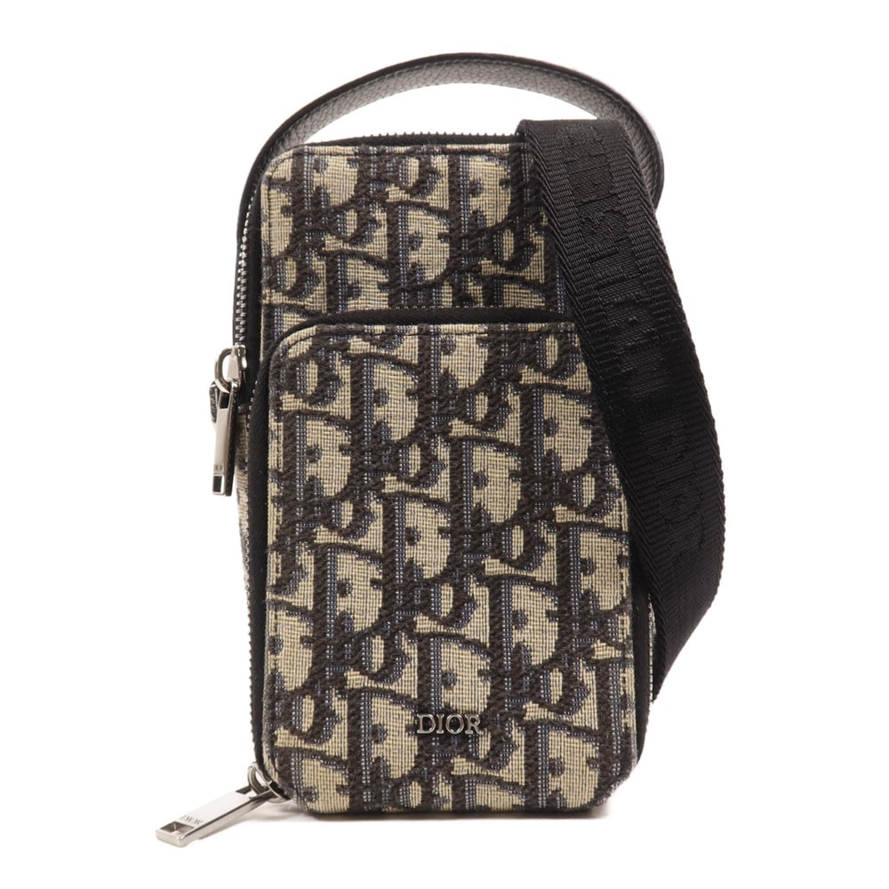 Dior Micro Rider Pouch: Authentic and authenticated Dior Micro Rider Pouch shoulder bag in black beige canvas. Product 11-BO-1202. Includes shoulder strap. Approx. 10 x 17 x 6 cm, handle 18 cm.