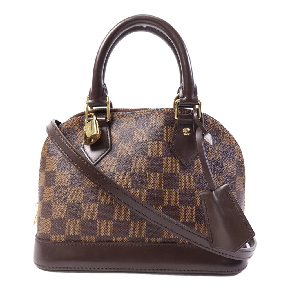 LV Alma BB Damier Ebene Brown: Brown Damier PVC coated canvas Alma BB 2-way hand bag with shoulder strap, clochette, keys, and padlock. Approx. 23.5 x 17.5 x 11.5 cm. Product no. AA4134. Authentic and authenticated.