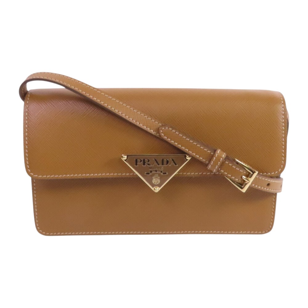 Prada Mini Saffiano Shoulder Brown: Brown and cream saffiano leather mini shoulder bag. Includes box and storage bags. 19 x 10.5 x 5.5 cm.